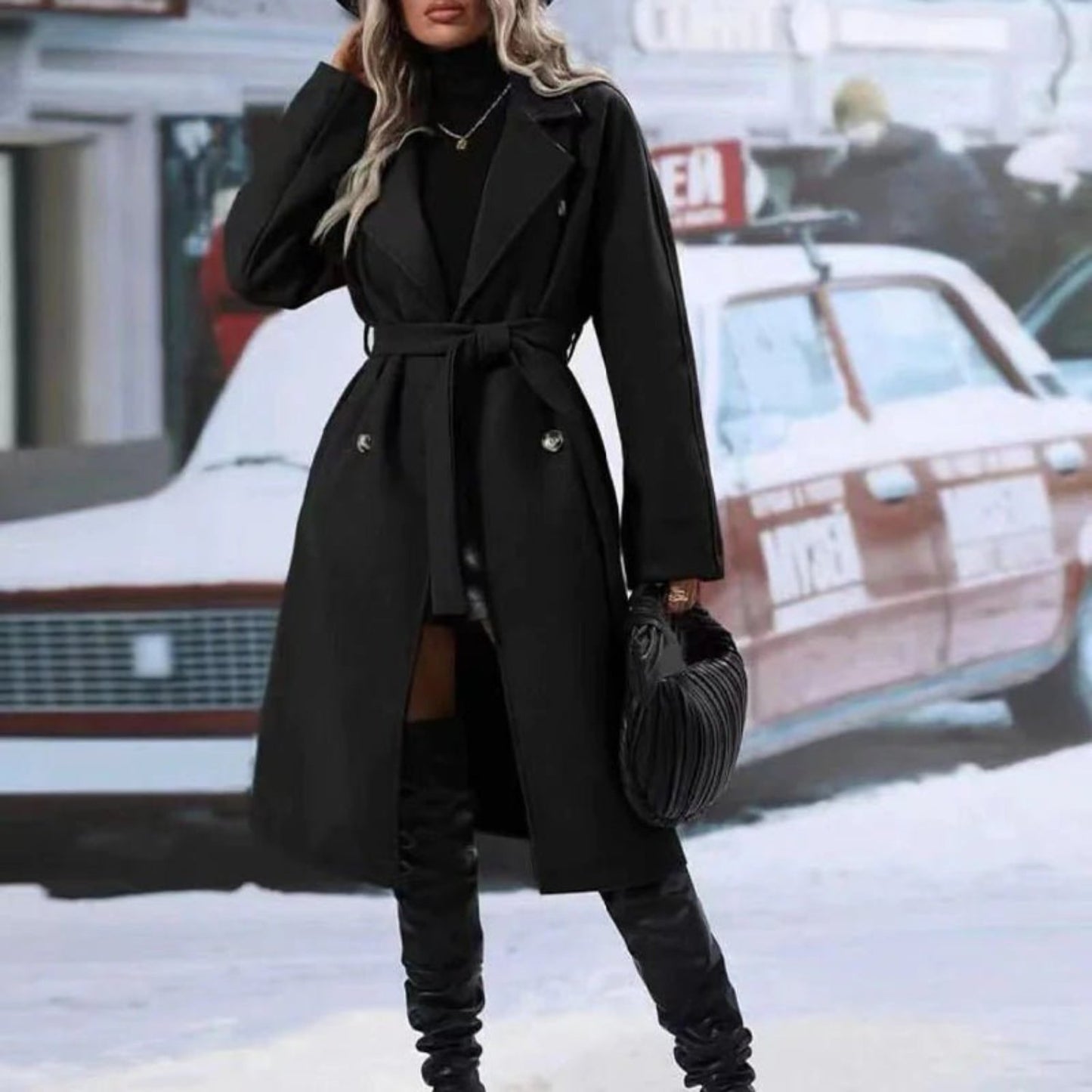 Double-breasted trench coat with a lace-up belt, offering stylish outerwear.