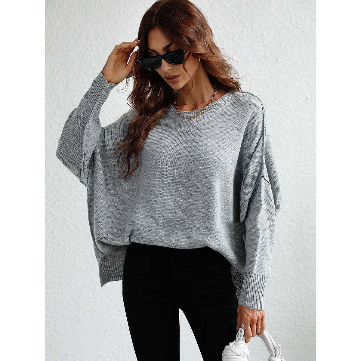 Long sleeve crew neck sweater for women, stylish and comfortable.