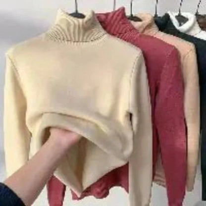 Women's elegant turtleneck sweater, thick, warm, and stylish winter pullover.