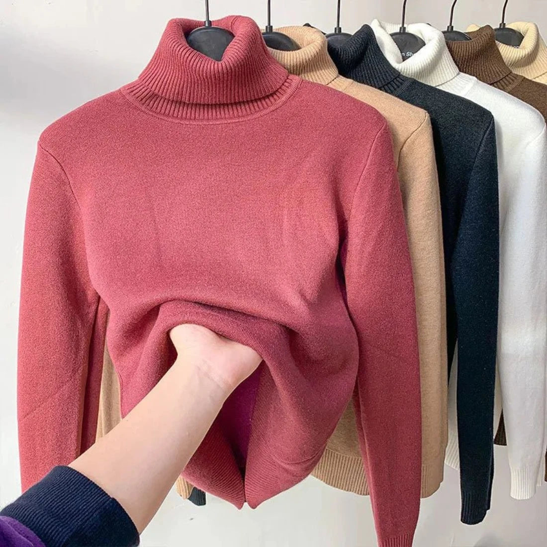 Women's elegant turtleneck sweater, thick, warm, and stylish winter pullover.