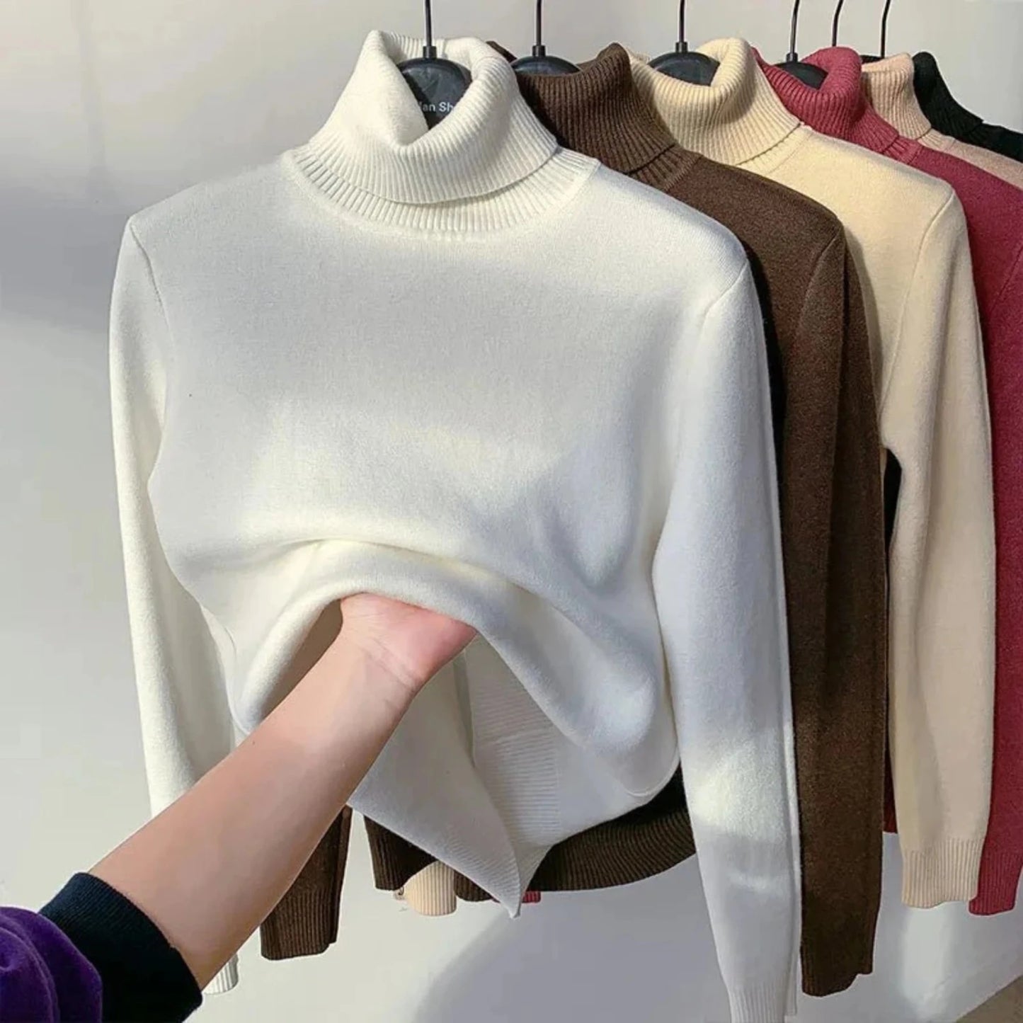 Women's elegant turtleneck sweater, thick, warm, and stylish winter pullover.