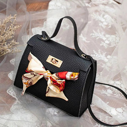 Leather handbag with scarf for an elegant and stylish look.