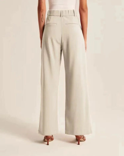 Chic wide-leg trousers with pockets and a slimming high-waist design.