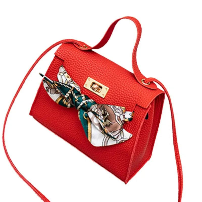 Leather handbag with scarf for an elegant and stylish look.